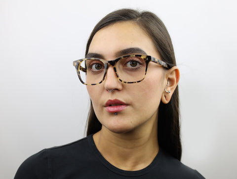 Woman wearing these luxury designer SEE Eyeglasses