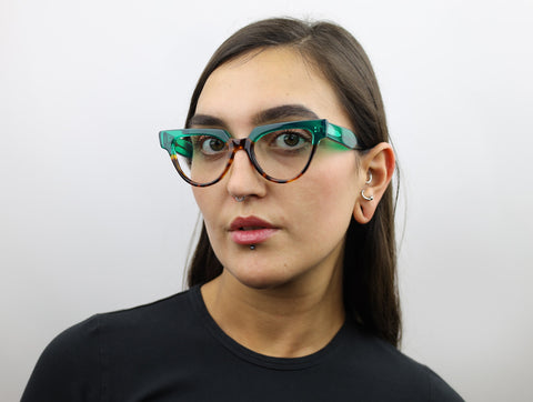 Woman wearing these luxury designer SEE Eyeglasses