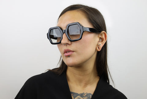 Woman wearing these luxury designer SEE Sunglasses