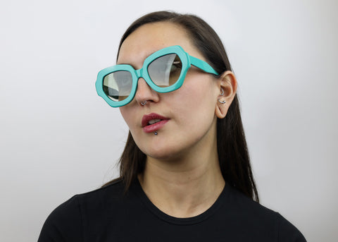 Woman wearing these luxury designer SEE Sunglasses