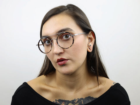 Woman wearing these SEE Eyeglasses