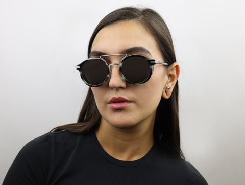 Woman wearing these luxury designer SEE sunglasses