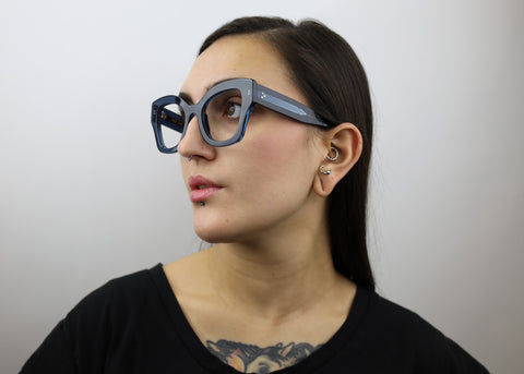 Woman wearing these luxury designer SEE Eyeglasses