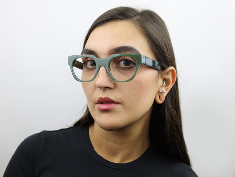 Woman wearing these luxury designer SEE Eyeglasses