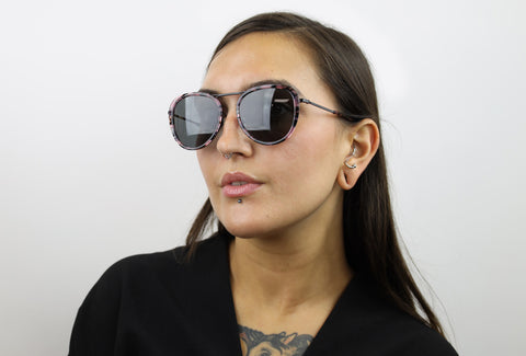 Woman wearing these luxury designer SEE sunglasses