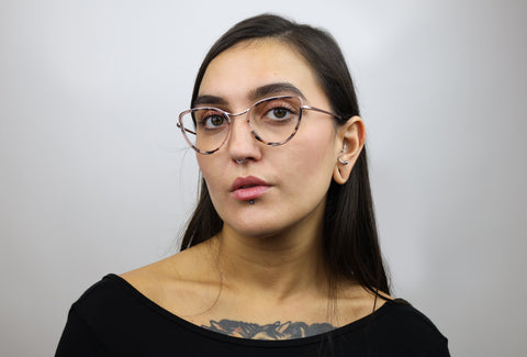 Woman wearing these luxury designer SEE Eyeglasses