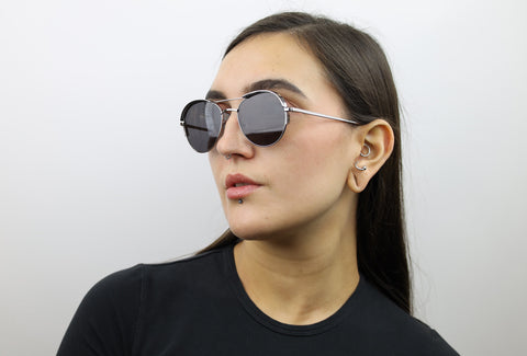 Woman wearing these luxury designer SEE sunglasses