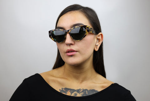 Woman wearing these luxury designer SEE sunglasses