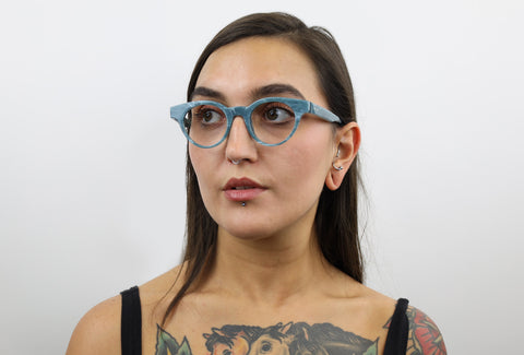 Woman wearing these luxury designer SEE Eyeglasses
