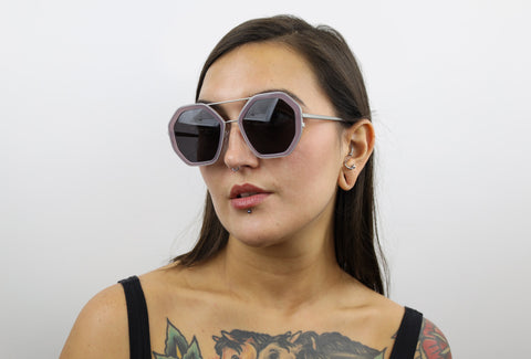Woman wearing these luxury designer SEE Eyeglasses