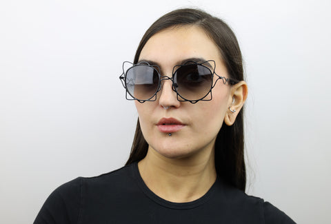 Woman wearing these luxury designer SEE sunglasses