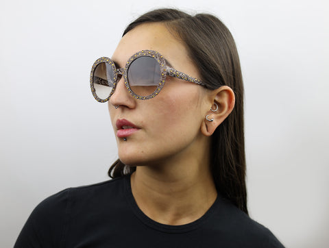 Woman wearing these luxury designer SEE sunglasses