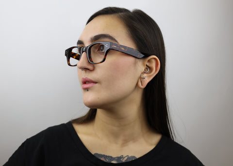 Woman wearing these luxury designer SEE Eyeglasses