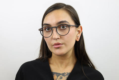Woman wearing these luxury designer SEE Eyeglasses