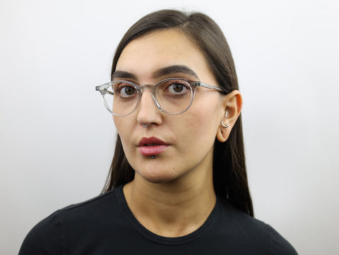 Woman wearing these luxury designer SEE Eyeglasses